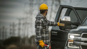 Construction worker getting out of his truck