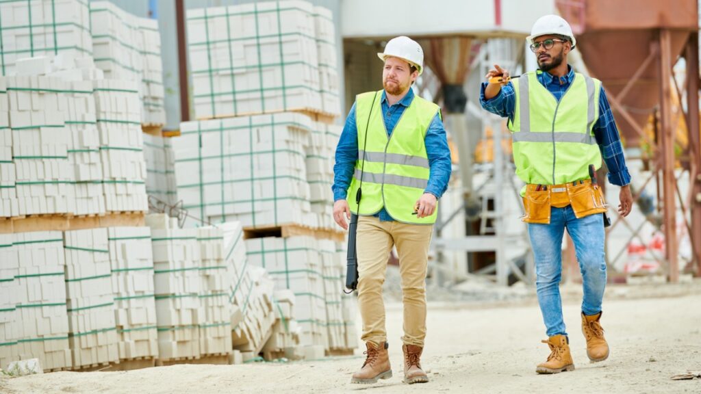 Two construction workers on a jobsite