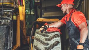 Diesel Mechanic looking at machine